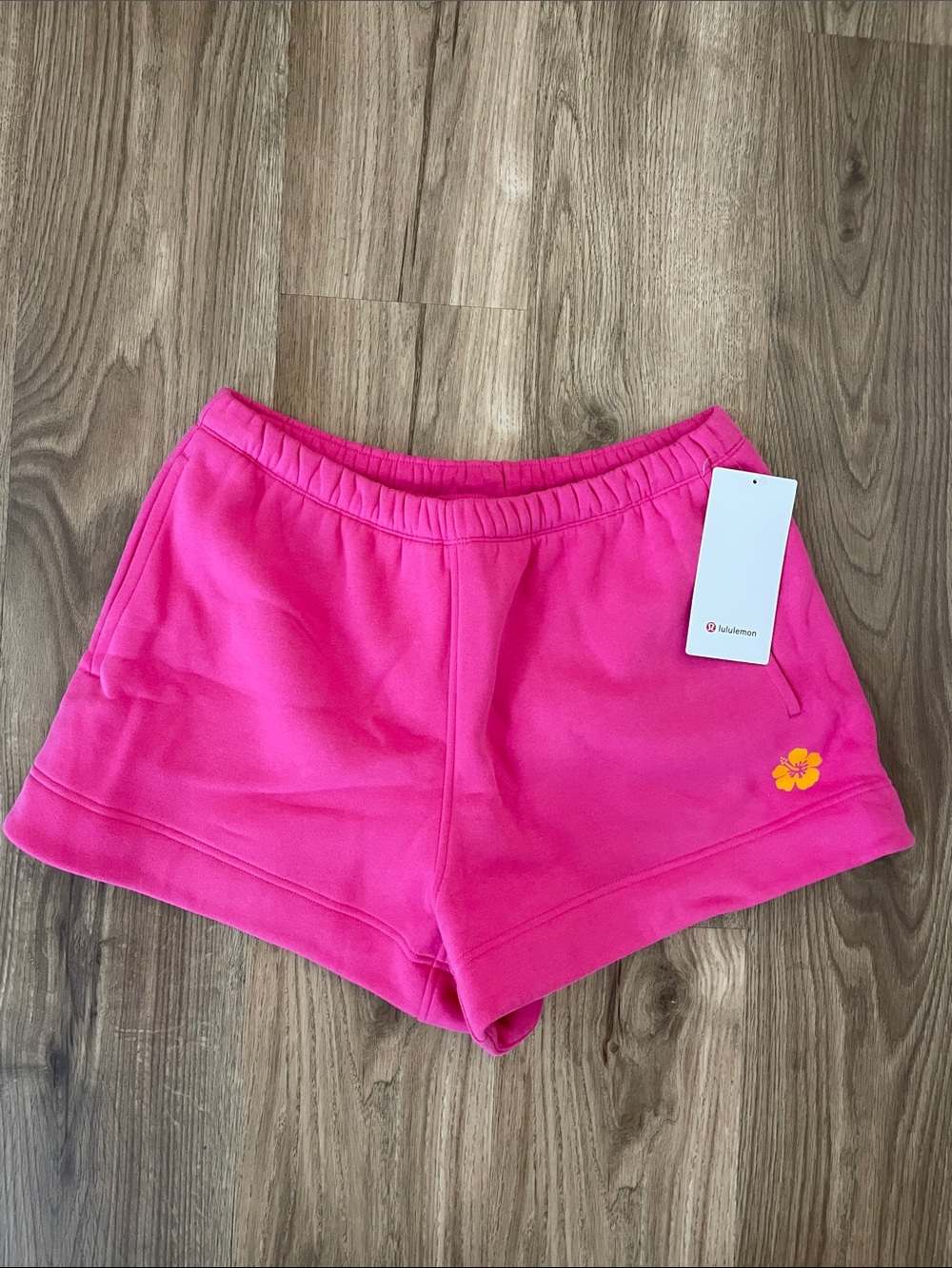 lululemon Hawaii Exclusive Pink Athletic Shorts with Yellow Floral Logo - Sz M